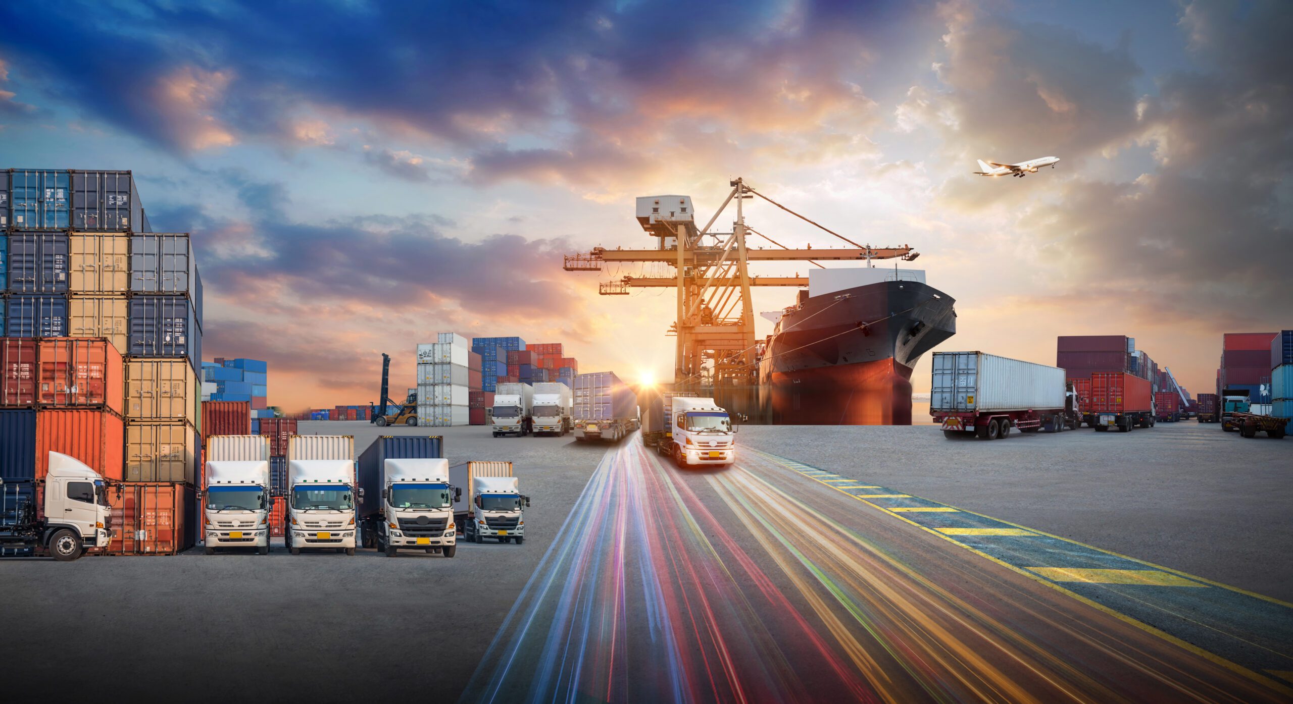 Global logistics operations at sunset — ships, trucks, and containers